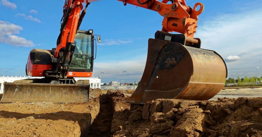 Heavy-duty excavator at work, representing the expertise and growth of NW Ohio excavation company Geddis Paving & Excavating.